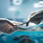 healthcare-medical-concept-close-up-surgeons-hands-holding-surgical-scissors-passing-surgical-equipment-motion-blur-56872443